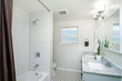 Beautiful Bathroom in white with shower curtain.