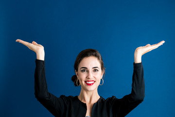 Wall Mural - Woman reaching and looking upwards