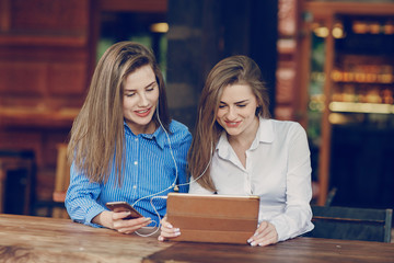 two girls in a cafe