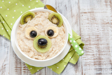 Kids breakfast porridge with fruits and nuts