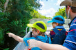 © Irina Schmidt - Two little kids boys and father making air boat tour in Everglades Park