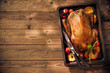 Christmas roast duck with apples and oranges on baking tray