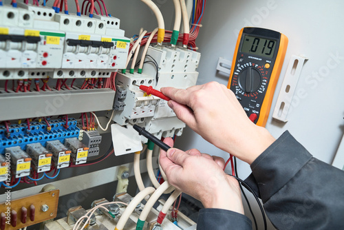 Fotomural electrician measurements with multimeter tester