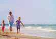 © nadezhda1906 - father with little son and daughter run at beach