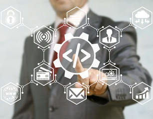 Wall Mural - businessman presses coding gear button on virtual screen on background of optimization automation se