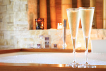 Two glasses of champagne near jacuzzi. Valentines background. Ro