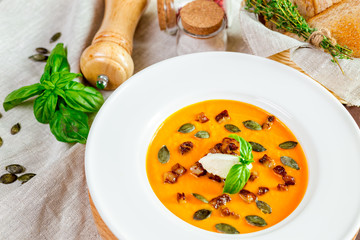 Pumpkin soup in white plate