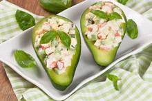 Avocado Salad / Avocado Stuffed With Crab, Cucumber, Egg, Red Onion And Sauce Mayonnaise On White Plate