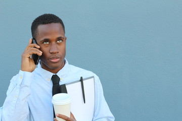 Young man rolling his eyes as a result of a call on his cellphone with space for copy