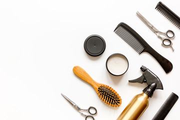 combs and hairdresser tools on white background top view