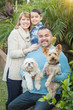 © Andy Dean - Happy Mixed Race Family Portrait Outdoors with Their Dogs.