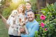 © Andy Dean - Happy Mixed Race Family Portrait Outdoors with Their Dogs.