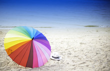 Beach Umbrella On A Sunny Day, Sea In Background