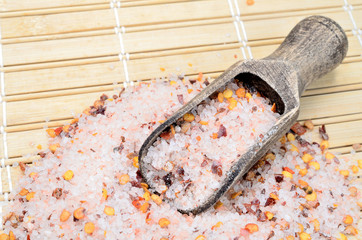 Canvas Print - pink salt with chili seed on table