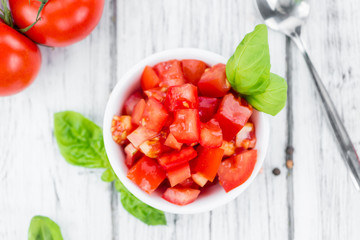 Wall Mural - Cutted Tomatoes on vintage wooden background