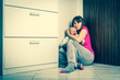 © andriano_cz - Abusing wife and baby covering in the corner - domestic violence