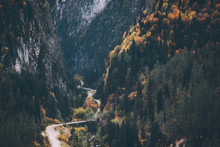 Highway Road In Mountains Landscape With Autumn Forest And Rocks Aerial Epic View