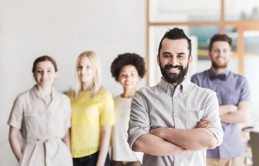 Canvas Print - happy young man over creative team in office