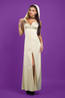 © nizienko - Young beautiful girl model on a purple background, clothing, adv