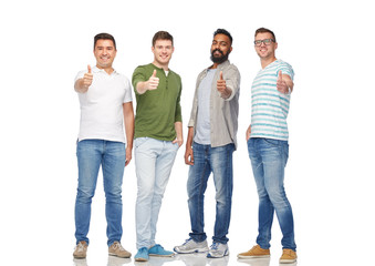 Wall Mural - happy smiling men showing thumbs up over white