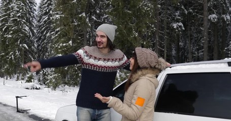 Wall Mural - Man And Woman Standing Near Car Winter Couple Walk In Snow Forest Snowy Mountain Park Slow Motion 60