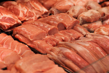 Poster - Variety of meat slices in boxes in supermarket