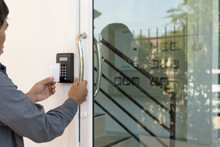 Close-up Hand Inserting Keycard To Lock And Unlock Door - Door A