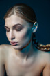 © julenochek - Model with cheek painted in blue