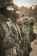 © Photographee.eu - Heavily armed soldiers in a row