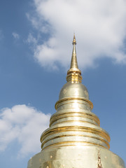 big beautiful golden pagonda with bule sky in Prasing temple in