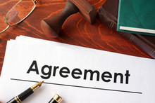 Agreement Form On An Office Table.