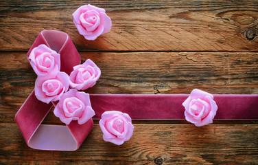 Wall Mural - velvet ribbon, pink roses on old wooden boards, 8 March composit
