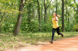 © Microgen - Young woman jogging