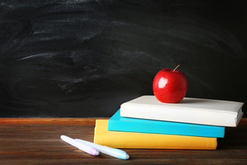 Sticker - Colorful school stationery on table on blackboard background