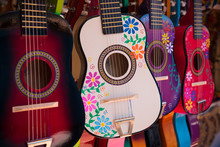 Display Of Ornate, Small Mexican Made Guitars