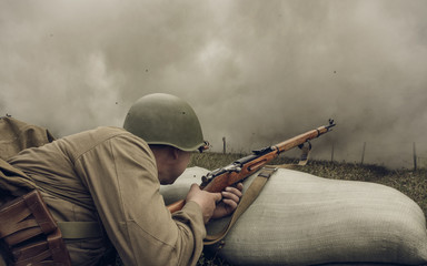 PERM, RUSSIA - JULY 30, 2016: Historical reenactment of World War II, summer, 1942. Soviet soldier with rifle