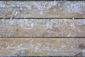 Snow-covered wooden background, texture, frozen wood