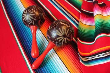 Wall Mural - Mexican blanket maracas poncho Mexico traditional cinco de mayo rug poncho fiesta background with stripes stock, photo, photograph, image, picture