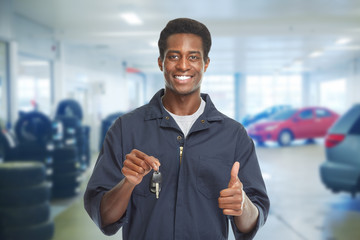 Wall Mural - Car mechanic with key.