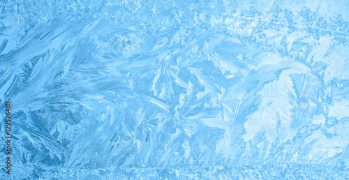beautiful winter ice, blue texture on window, festive background Fototapeta
