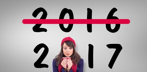 Sticker - Composite image of festive brunette holding a mug