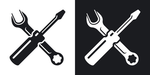 Simple two-color vector icon of a screwdriver and a wrench on a black and white background. Hand tools for repair and construction