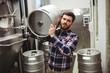 © WavebreakMediaMicro - Manufacturer carrying keg in brewery