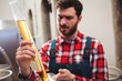 © WavebreakMediaMicro - Manufacturer examining beer in test tube