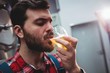 © WavebreakMediaMicro - Close-up of manufacturer tasting beer