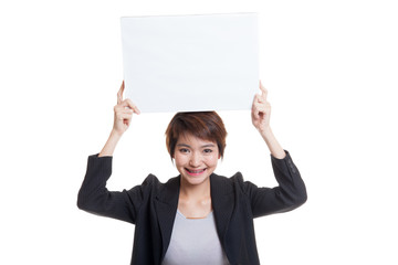 Wall Mural - Young Asian business woman with  white blank sign.