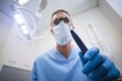 © WavebreakMediaMicro - Dentist holding dental tool
