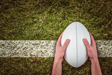 Poster - Composite image of rugby player catching a rugby ball