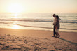 © Jacob Lund - Senior couple strolling on the beach at sunset