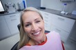 © WavebreakMediaMicro - Female patient sitting on dentist chair